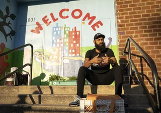 Dominic &quot;Farmer&quot; Nell helps teach people how to harvest and sell microgreens in Baltimore. - (Photo: Nathan Bolster/BET)