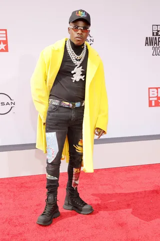 DaBaby - DaBaby stays in a designer 'fit! The &quot;Rockstar&quot; rapper walked the red carpet in a Prada jacket. Let's not forget the bling! (Photo by Amy Sussman/FilmMagic)