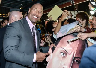 Strong Man in Japan - Dwayne Johnson signs autographs for fans at the Japan premiere of Hercules at Toho Cinemas in Tokyo.(Photo: Keith Tsuji/Getty Images for Paramount)