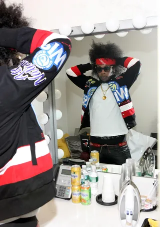 Check Me Out - Trinidad James fixes himself before he hits the stage.&nbsp;&nbsp; (Photo: Bennett Raglin/BET/Getty Images for BET)