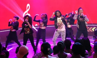 A Little Touch Up - Wild Out Wednesday contestants Love Jones Girlz primp themselves while on stage.&nbsp; (Photo: Bennett Raglin/BET/Getty Images for BET)