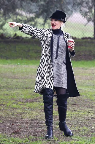 Gwen Stefani - The always stylish Gwen Stefani was spotted at a park in LA. We love how she coordinated her printed pieces with a fedora and tall boots.  (Photo: WENN.com)