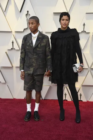 Pharrell Williams&nbsp;in Chanel and Helen Lasichanh - (Photo: Frazer Harrison/Getty Images)&nbsp;