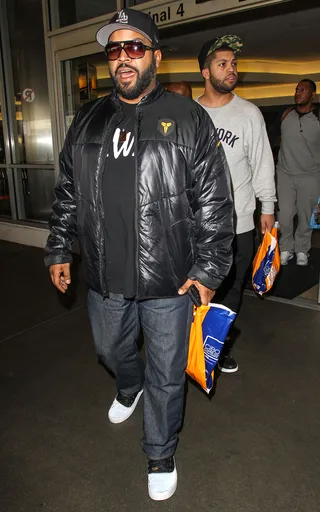 Like Father, Like Son - Ice Cube and his son O'Shea Jackson Jr. arrive home looking like mirror images at LAX Airport in Los Angeles.(Photo: Image Press/Splash News)