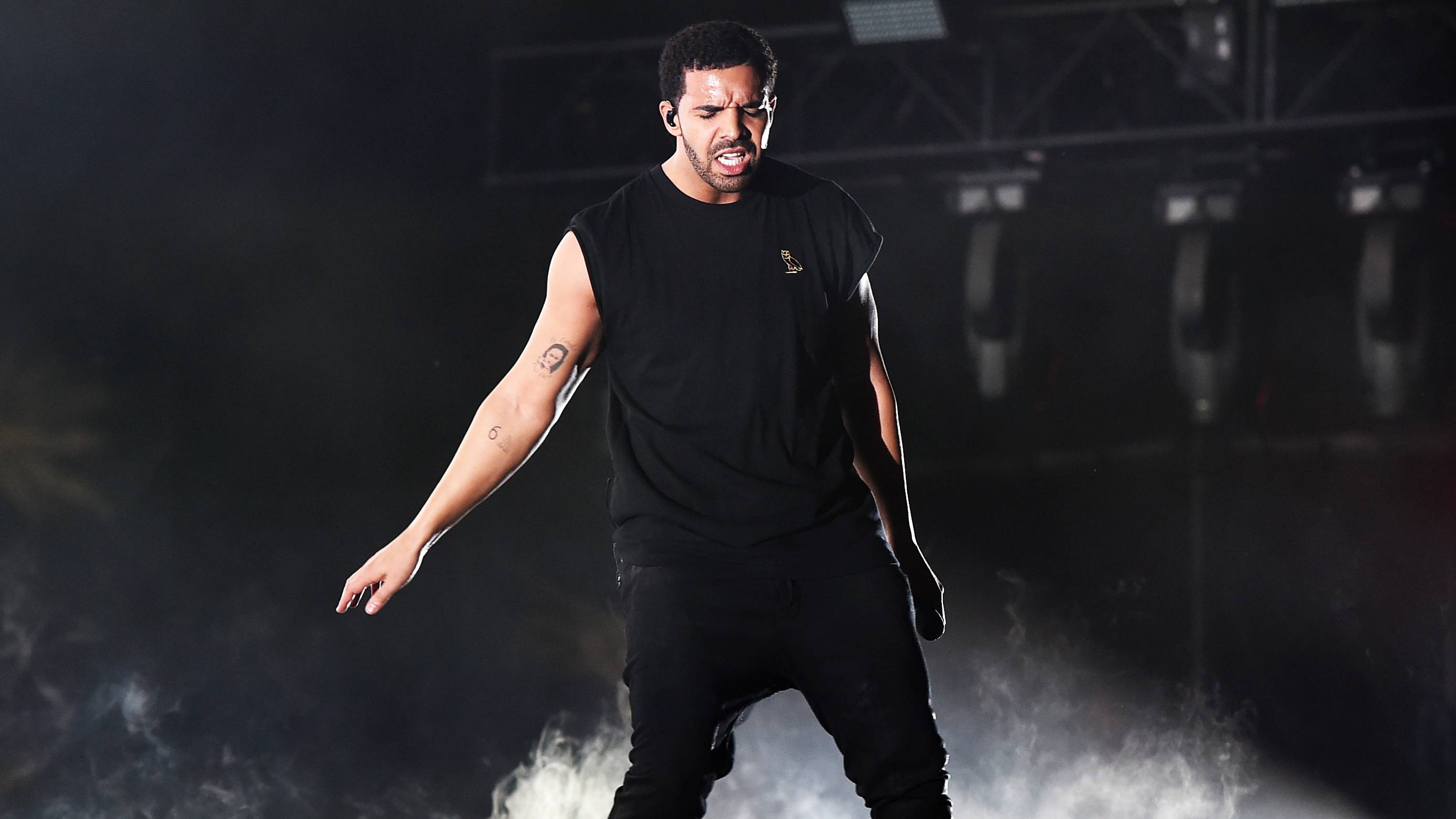 INDIO, CA - APRIL 12:  Rapper Drake performs onstage during day 3 of the 2015 Coachella Valley Music   Arts Festival (Weekend 1) at the Empire Polo Club on April 12, 2015 in Indio, California.  (Photo by Kevin Winter/Getty Images for Coachella)