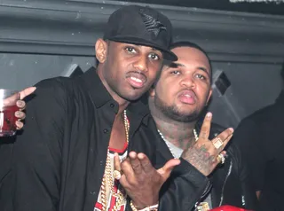 Whatcha Lookin' At? - Fabolous isn't ready for his closeup when the photogs capture this shot of him and DJ Mustard partying at YMCMB's DJ E-Feezy&nbsp;Birthday Party Presented by Hennessy V.S at the IVY in Miami.(Photo: Thaddeaus McAdams)