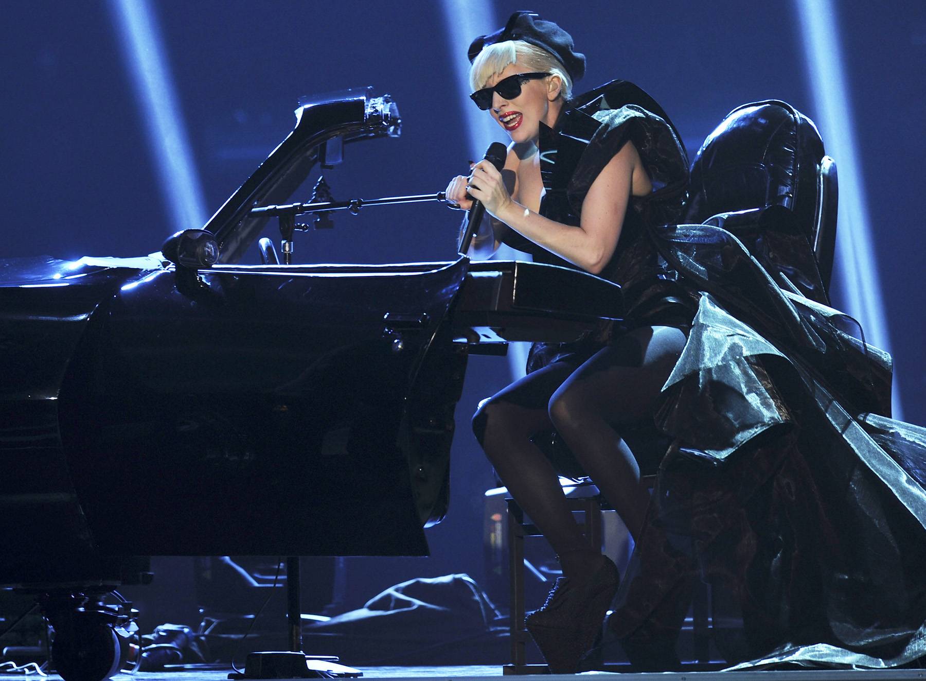 Playing in the Car - Lady Gaga performs during the 2011 Bambi Award at the Rhein-Main-Hallen in Wiesbaden, Germany. The eccentric star wears layers of taffeta while she sings at a piano built into a car frame. (Photo: Christian Augustin/Getty Images)