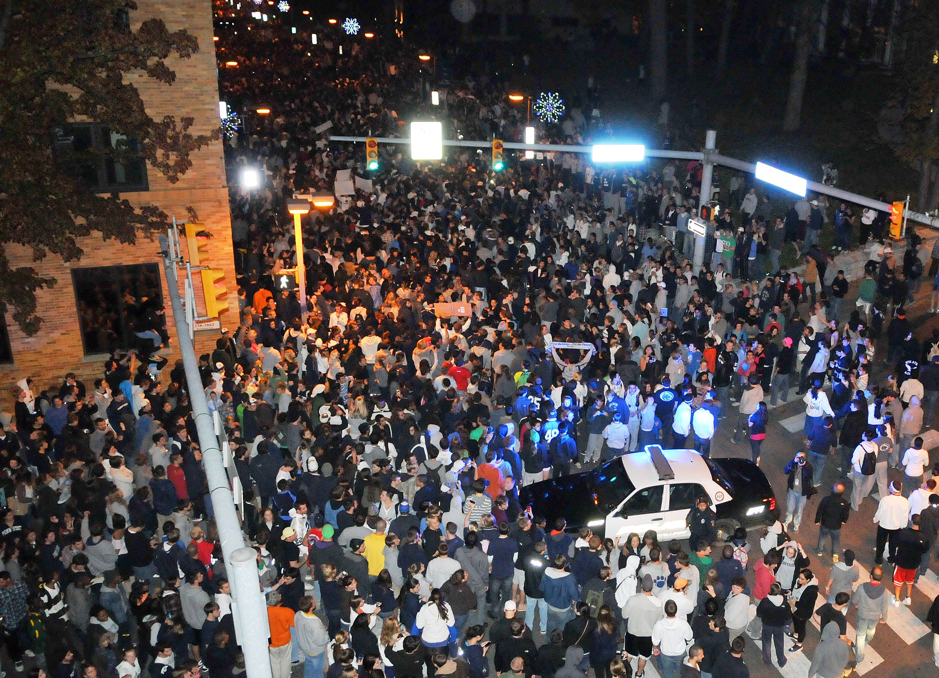 Penn State Students Riot After Joe Paterno Firing&nbsp; - The Penn Sate Board of Trustees abruptly fired beloved head football coach Joe Paterno and Penn State president Graham Spanier on Nov. 9, in light of the child sex scandal involving Paterno’s former assistant coach Jerry Sandusky. The news whipped some students into a frenzy as they spilled into the streets and tipped over a news van. Two days later, thousands of students held a vigil for victims of sexual abuse.(Photo: REUTERS/Pat Little)