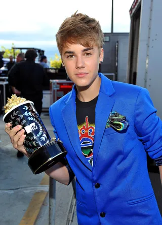 Golden Boy - Justin Bieber poses with his award for Best Jaw Dropping Moment backstage at the MTV Movie Awards.(Photo by Mark Davis/MTV/PictureGroup