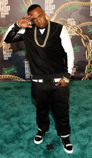 Yo Gotti&nbsp; - &nbsp;Yo Gotti goes white and black on the green carpet.(Photo: Bennett Raglin/BET/Getty Images for BET)