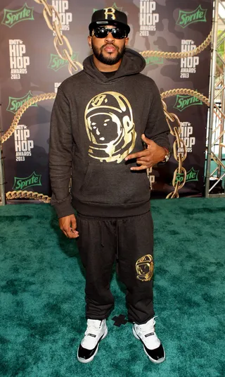 Mike WiLL Made It - Super producer Mike WiLL Made It stays on trend with a black-and-gold jogging suit and his signature black shades.&nbsp;(Photo: Bennett Raglin/BET/Getty Images for BET)