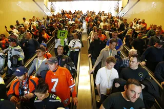 Pre-Game Scare - Emergency medical workers pushed their way through the crowd to treat several people who collapsed at a packed New Jersey train station on the way to the game.(Photo: AP Photo/Matt Rourke)