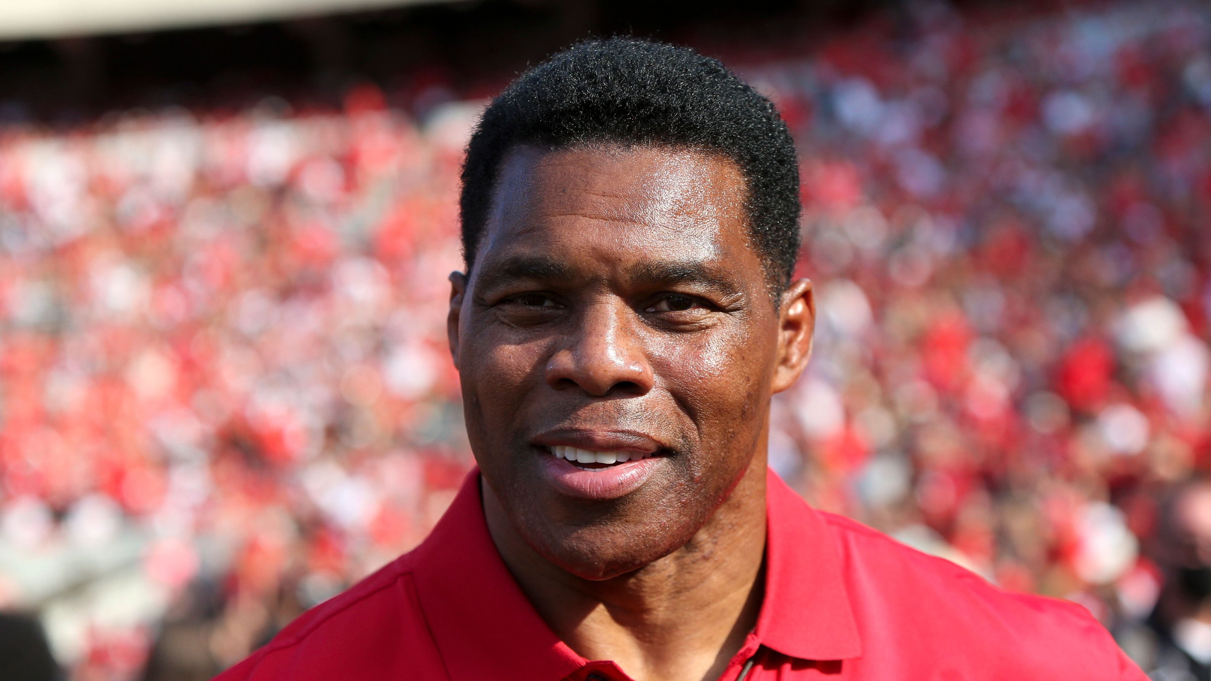 Former running back Herschel Walker for the Georgia Bulldogs on the sidelines.