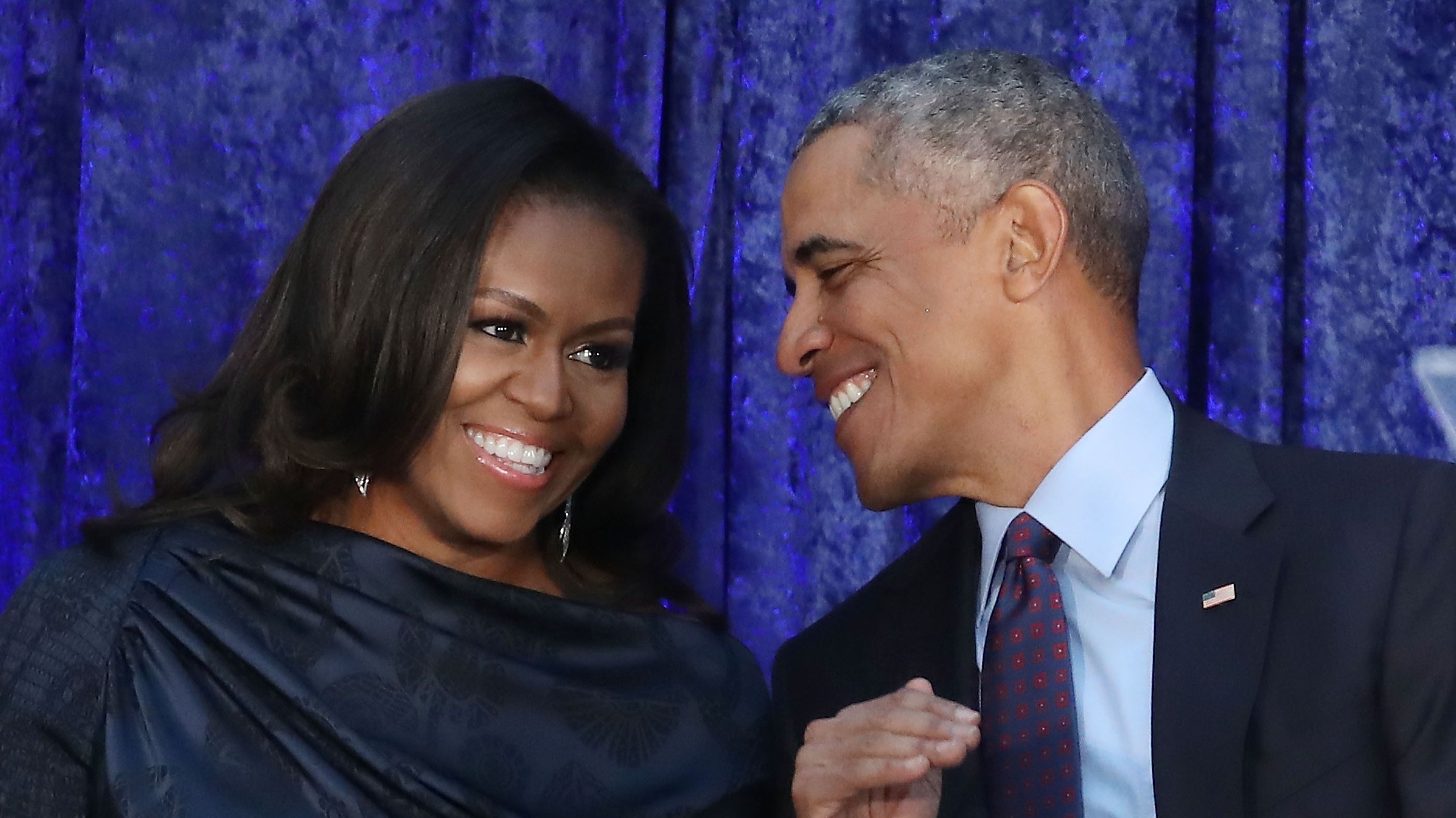 Former U.S. President Barack Obama and first lady Michelle Obama participate in the unveiling of their official portraits during a ceremony at the Smithsonian's National Portrait Gallery, on February 12, 2018 in Washington, DC. 