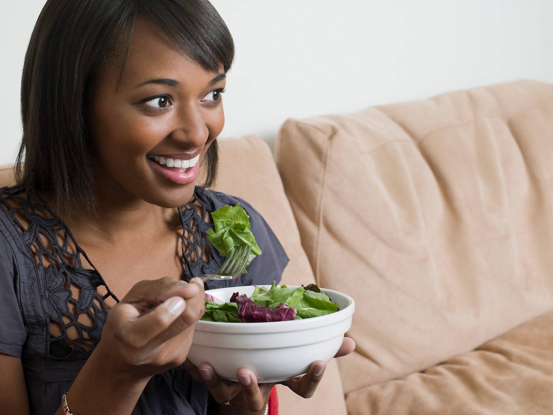 woman eating salad