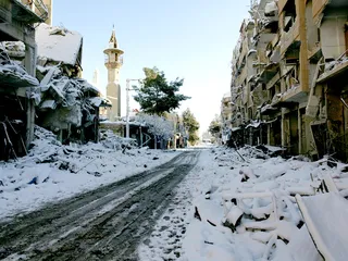 Syrian Warplanes Strike Suburbs - Syrian fighter jets bombed Damascus suburbs Sunday in a government offensive to dislodge rebels from strategic areas around the capital. At least 34 Syrians wounded in the attacks were brought to neighboring Turkey for treatment.  (Photo: Kenan Al-Deran/Landov/Shaam News Network/Handout)