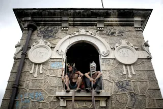 Brazil’s Indigenous Refuse to Move - Police in riot gear threatened to evict a settlement of indigenous people next to Rio de Janeiro's Maracana stadium over the weekend. The group includes men and women of about 10 ethnicities who have been squatting for years in a few homes they built on the site of an old Indian Museum.(Photo: Felipe Dana/AP Photo)