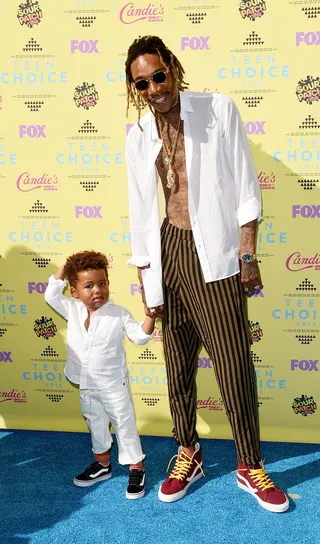 Wiz Khalifa&nbsp;and Sebastian Taylor Thomaz - We are most definitely here for baby Bash's style! The cutie&nbsp;matches his father in a white&nbsp;button-up shirt&nbsp;and Vans.(Photo: Jason Merritt/Getty Images)
