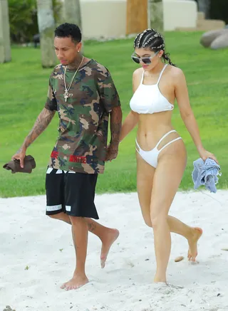 Surf's Up - The teen is spotted heating up the sands of Mexico with boyfriend Tyga.  (Photo: Brian Prahl/Splash News/Corbis)