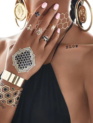 Love You Like XO - Complete with your BeyHive accents by draping your hands in these golden bees.(Photo: Erik Ian courtesy of Flash Tattoos)