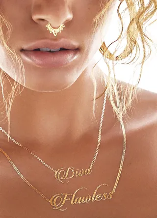 Chaining Day - There's no snatching this "Diva" necklace. It's a permamnent state of mind.(Photo: Erik Ian courtesy of Flash Tattoos)