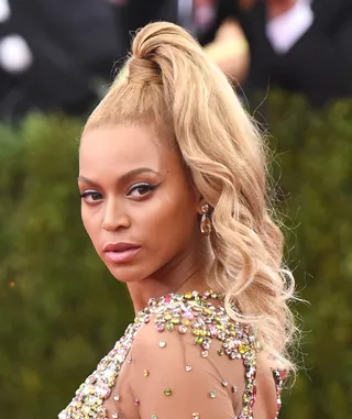 Beyoncé - Evoke Bey’s look from the 2015 Met Gala&nbsp;— and the “Queen-to-be” in Coming to America&nbsp;— with this sexy high ponytail.&nbsp; (Photo: Mike Coppola/Getty Images)