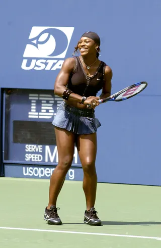 Fair Game - This cute tennis ensemble with pleated denim skirt says it's okay to mix work and play. And why not? She's having fun.  (Photo: Bryan Bedder/Getty Images)