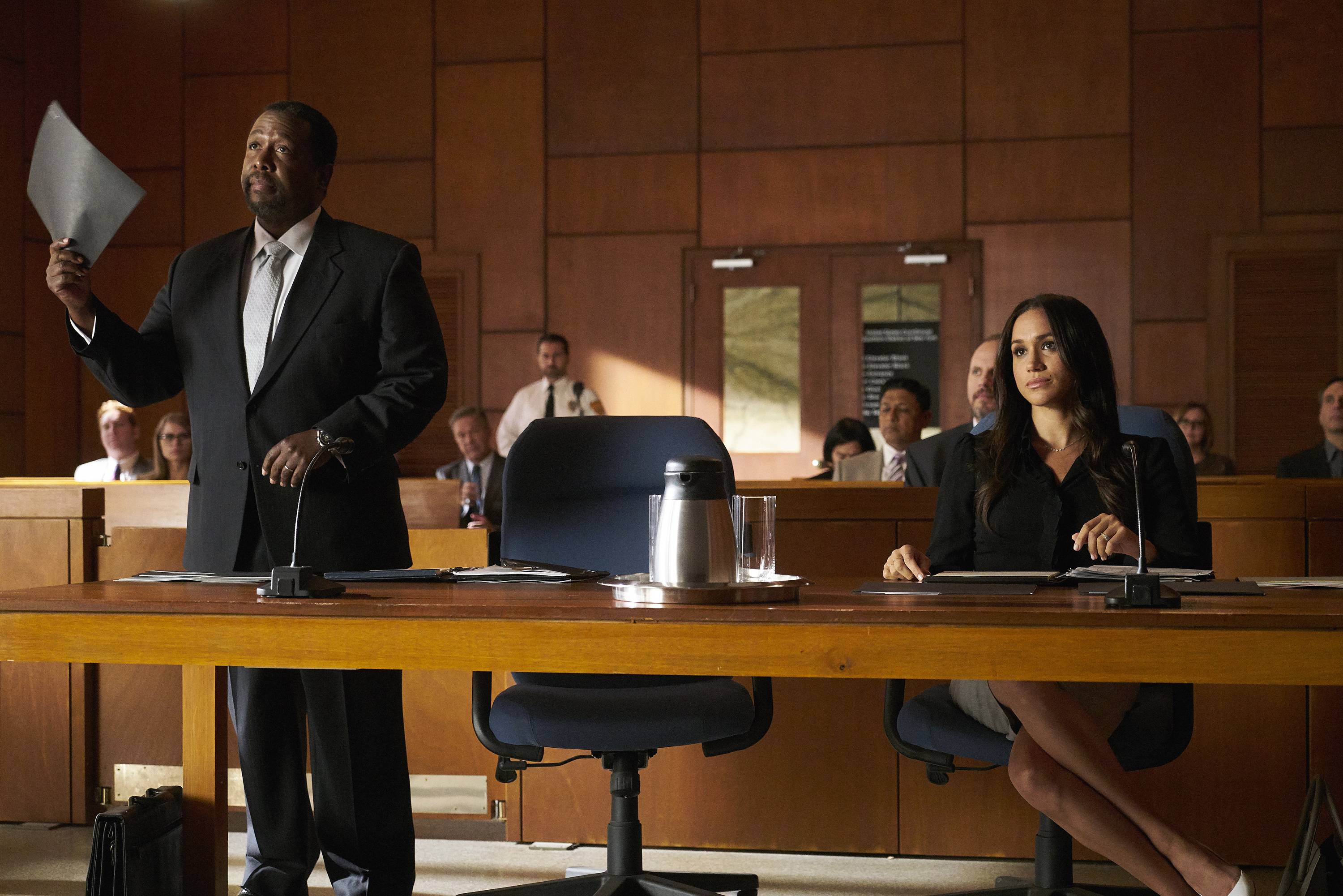 SUITS -- "Shame" Episode 709 -- Pictured: (l-r) Wendell Pierce as Robert Zane, Meghan Markle as Rachel Zane -- (Photo by: Ian Watson/USA Network/NBCU Photo Bank)