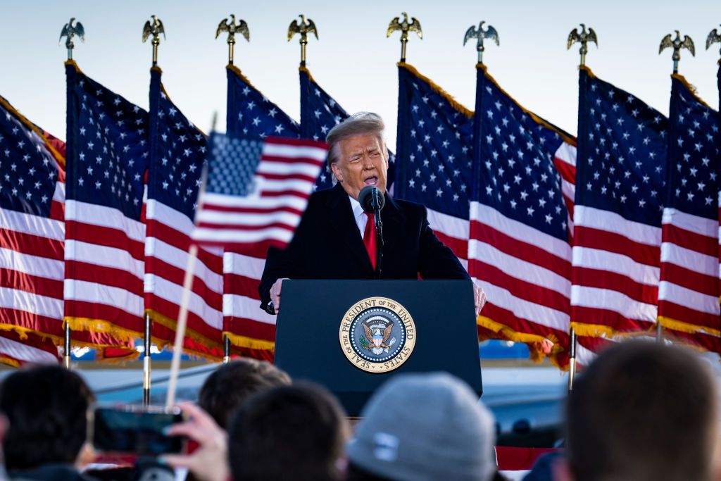 President Donald Trump speaks to supporters at Joint Base Andrews before boarding Air Force One for his last time as President on January 20, 2021. Trump is traveling to his Mar-a-Lago Club in Palm Beach, Fla. (photo by Pete Marovich for The New York Times)

NYTINAUG