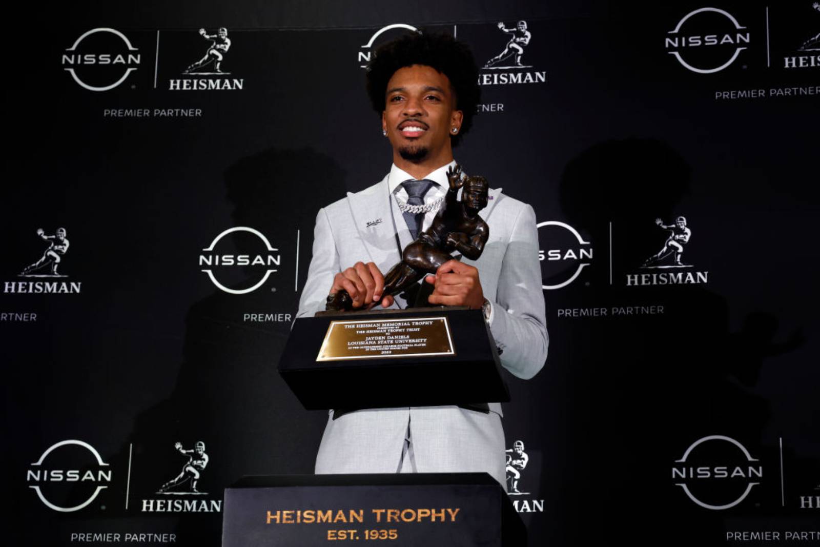 Quarterback Jayden Daniels of the LSU Tigers poses with The Heisman Memorial Trophy at New York Marriott Marquis Hotel on December 09, 2023 in New York City. (Photo by Sarah Stier/Getty Images)