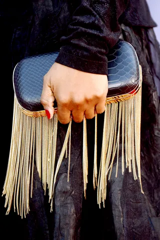 Fringed and Fabulous - Vivian Green adds edge to her all-black-everything getup with an oval black snakeskin clutch with chain details. Her red-hot mani is also on-point.   (Photo: Bryan Steffy/BET/Getty Images)