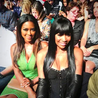 Kenya Moore - Real Housewives of Atlanta star Kenya Moore glows in green from her perch in the crowd.  (Photo: Kenya Moore via Instagram)