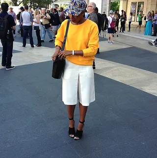 Monroe Steele - The fashion blogger accents her marigold-hued sweatshirt and cream shorts with a pretty graphic-print hat. One of our style essentials for surviving fashion week!  (Photo: Monroe Steele via Instagram)