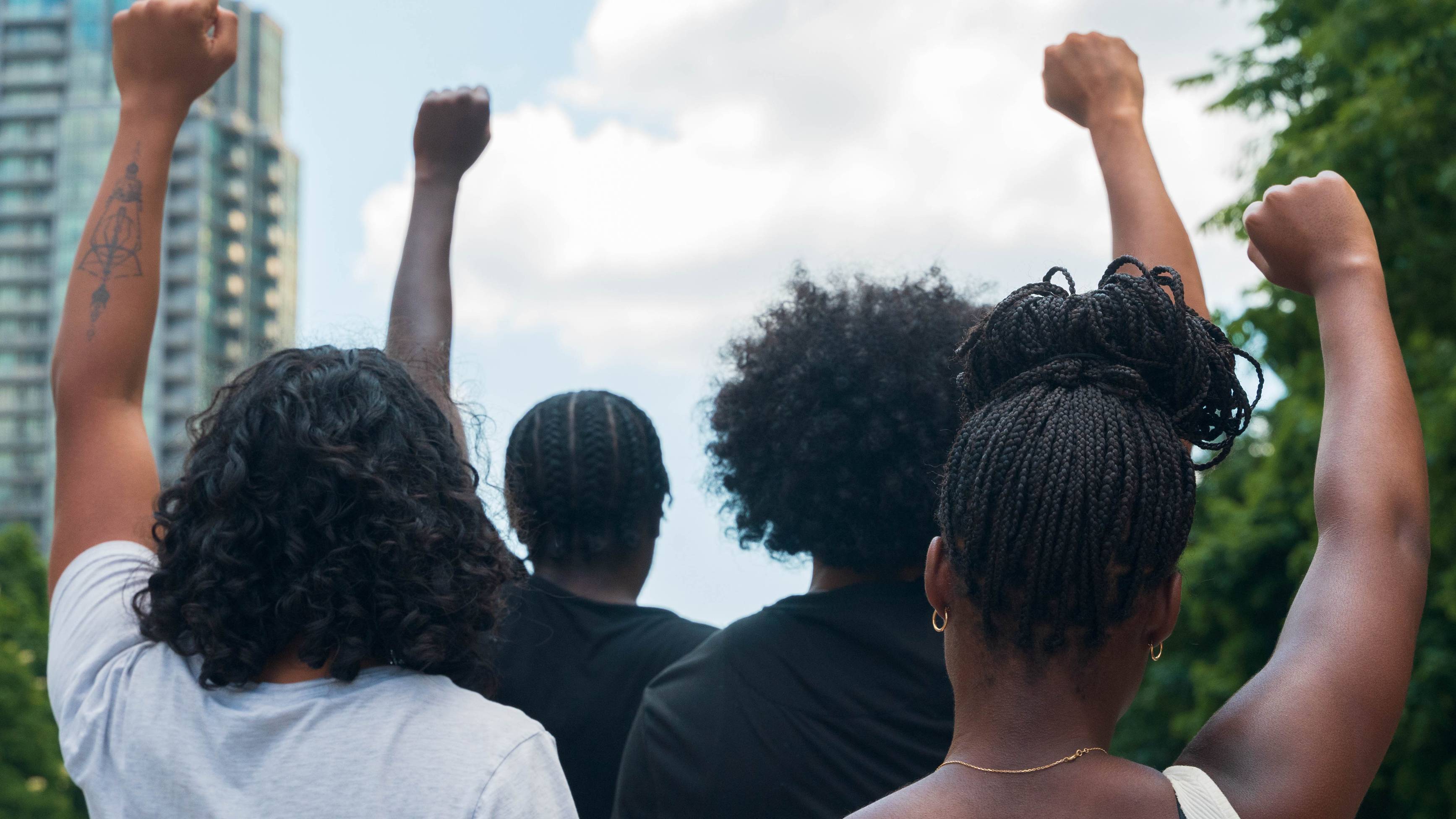 A group of African American people protests racial injustice 