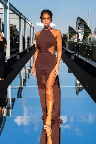 SEPT. 8:&nbsp;Lori Harvey - Lori Harvey wore a goddess-style maxi dress while posing on the mirrored runway at the DUNDAS x REVOLVE show. (Photo by Gotham/WireImage) (Photo by Gotham/WireImage)