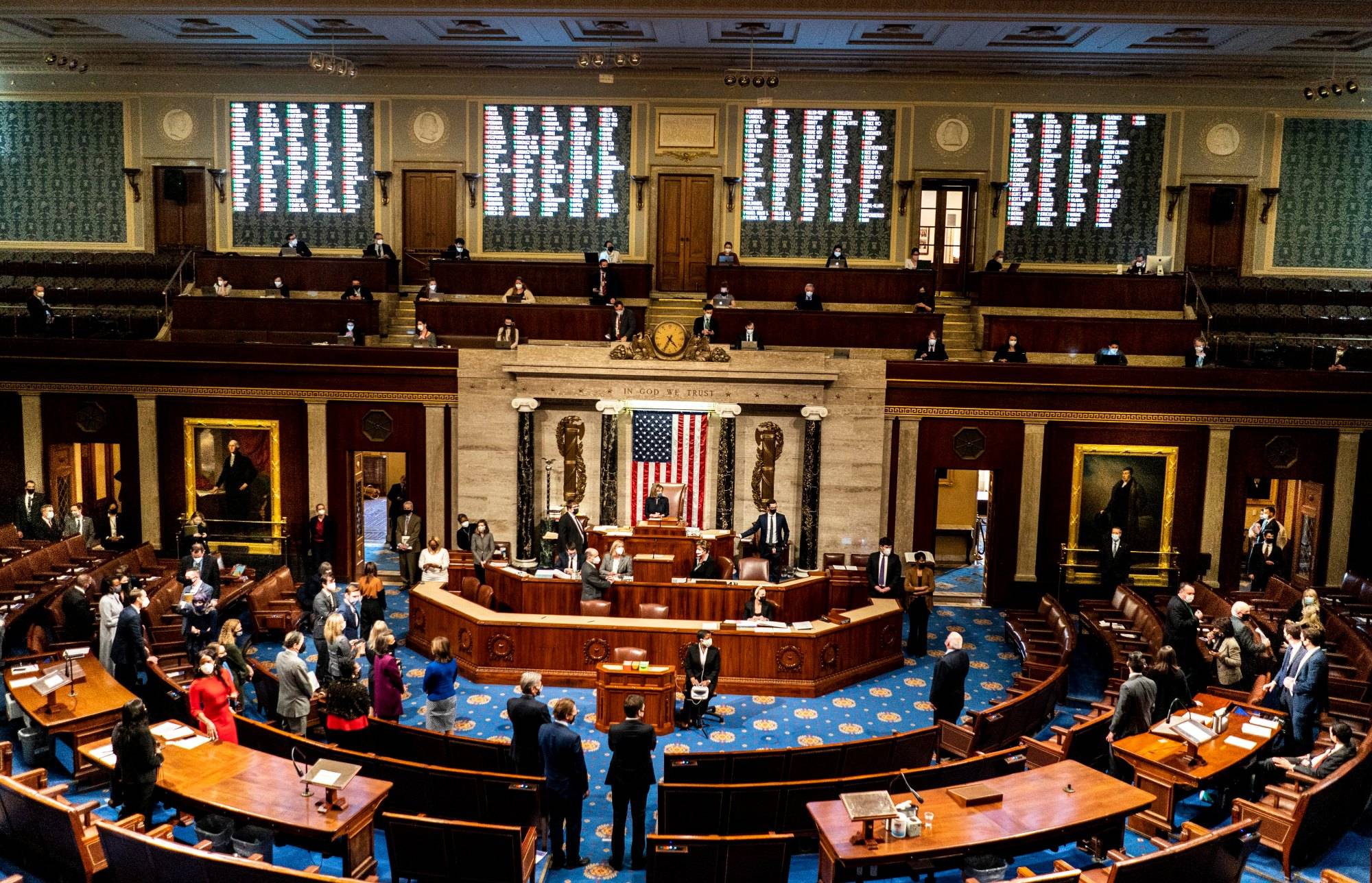 WASHINGTON, DC - JANUARY 13, 2021: A week after the insurrection of the U.S. Capitol, with Speaker of the House Nancy Pelosi presiding the House of Representatives votes to impeach Donald Trump, President of the United States, for high crimes and misdemeanors, on the House floor in Washington, DC Wednesday January 13, 2021. (Photo by Melina Mara/The Washington Post)