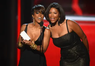 Introducing Mrs. Witherspoon - Newlywed Kelly Rowland presents the Milestone Award to Carrie Underwood.  (Photo: Ethan Miller/Getty Images)