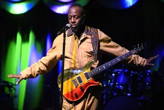 Moment of Silence - Wyclef Jean shows support for the victims of a terror attack in Brussels during his concert at the Brooklyn Bowl on Tuesday night.   (Photo: Matthew Eisman/Getty Images)