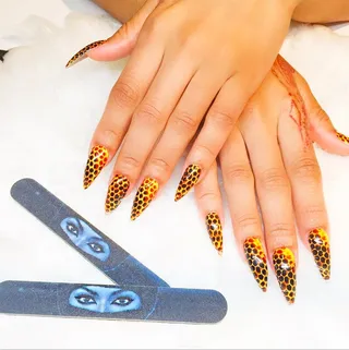 Blac Chyna - The model dresses her lengthy talons in a bold honeycomb print. We likey.  (Photo: Blac Chyna via Instagram)