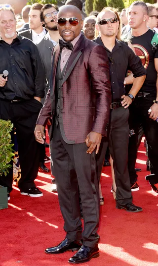 Floyd Mayweather Jr. - It’s no wonder they call him “Money” — the undefeated champion boxer always looks like a million bucks. And this mixed-print tuxedo look is no exception.&nbsp;  (Photo: Jason Merritt/Getty Images)