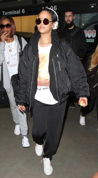 Airport Comfort - Rihanna looked comfy and cozy as she made her way into LAX to board her flight.(Photo: WENN.com)