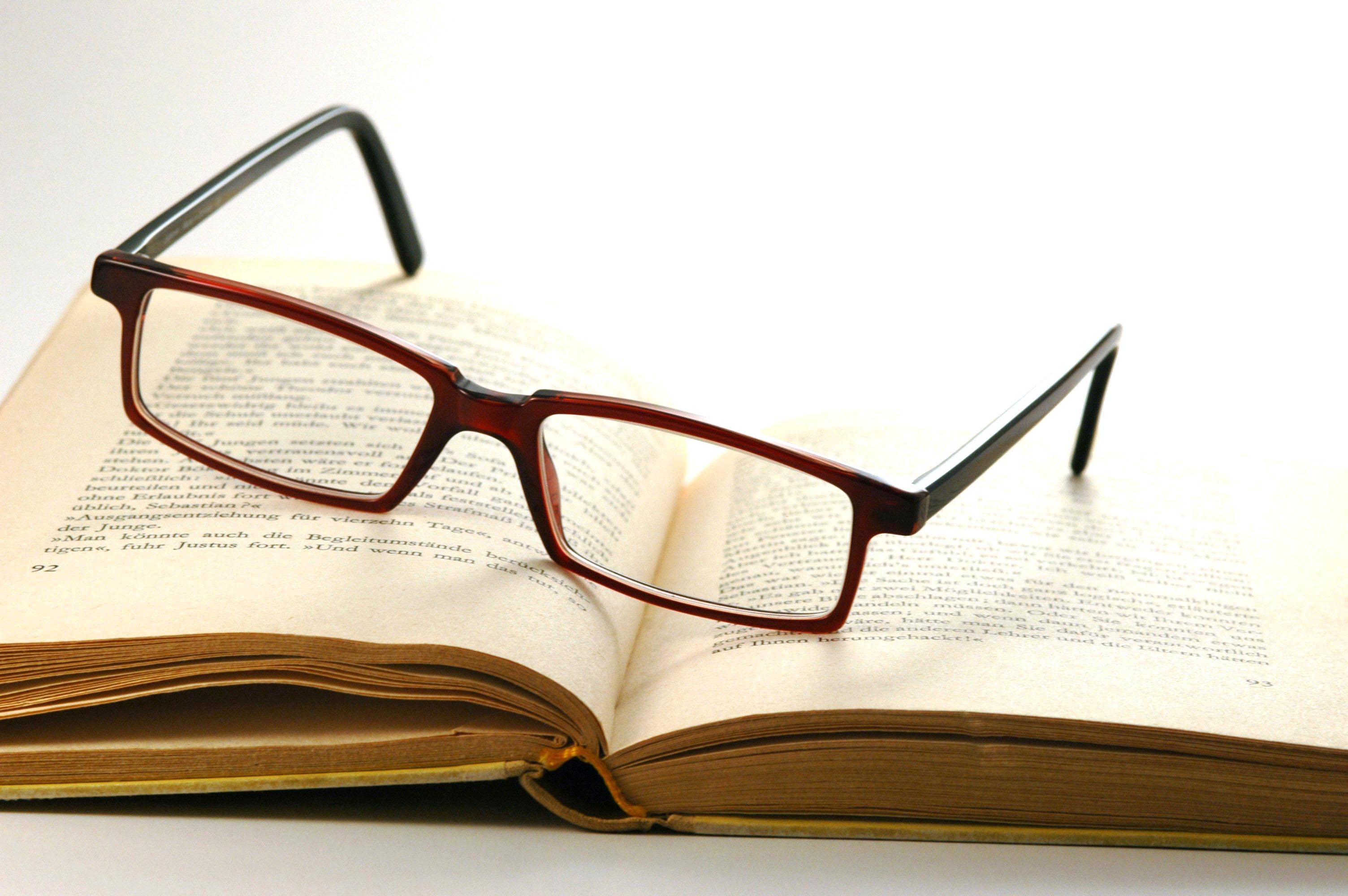 book with reading glasses