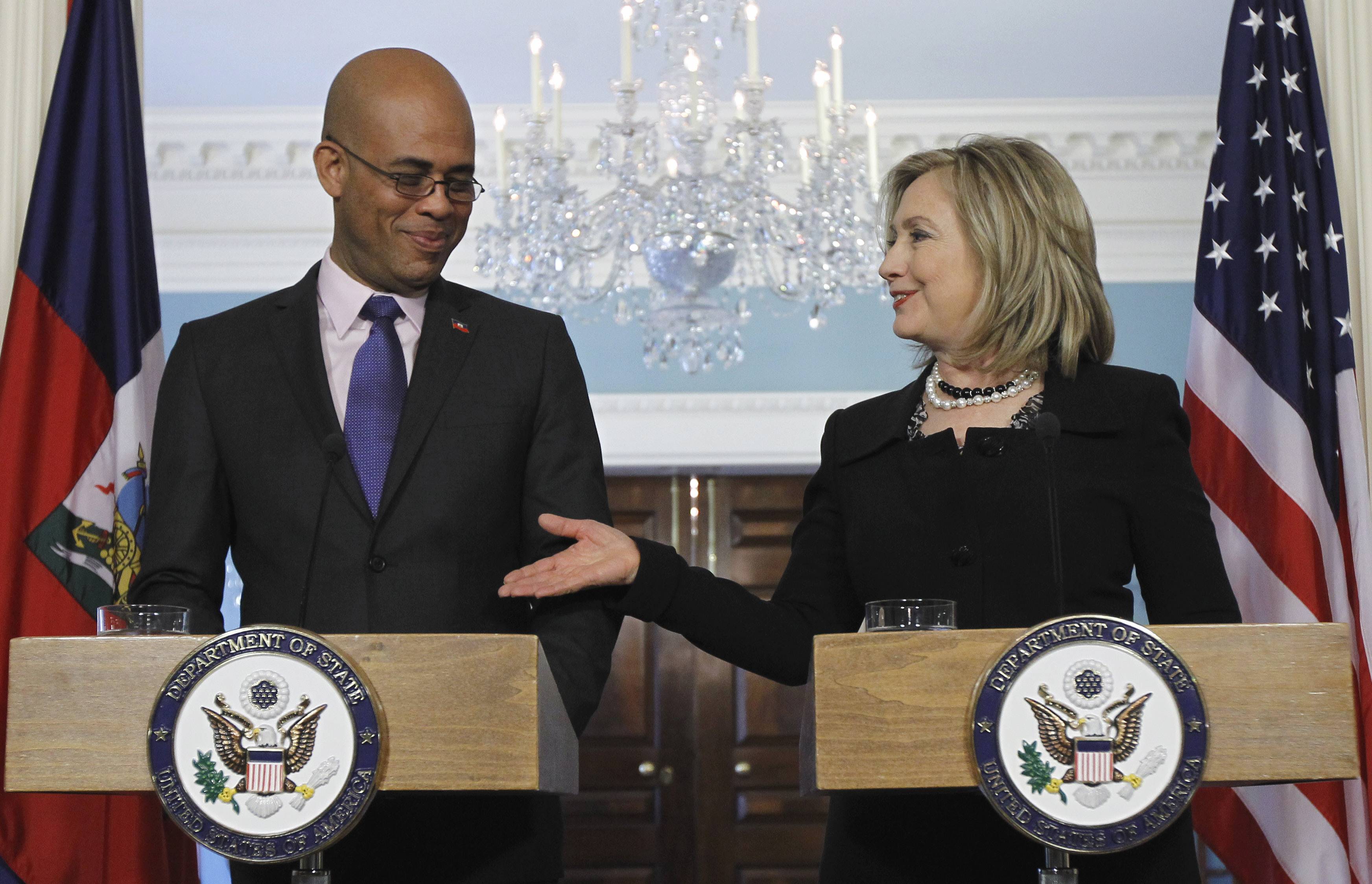 Newly Elected Haitian Leader Visits U.S. - During a meeting with Haiti's President-elect Michel "Sweet Micky" Martelly Wednesday, U.S. Secretary of State Hillary Clinton Wednesday congratulated the new leader and said the earthquake-ravaged nation has the full support of the U.S. in the island’s development. Martelly has his work cut out for him though his presidency doesn’t start until May. There are 650,000 people living in temporary camps as a result of the January 2010 earthquake, the capital of Port-au-Prince is in ruins and hurricane season is approaching.http://www.bet.com/news/global/2011/04/20/clinton-gives-u-s-support-for-haiti-s-new-president-.htmlTAGS: Hillary Rodham Clinton, Michel Martelly, Haiti (Photo: AP Photo/Alex Brandon)