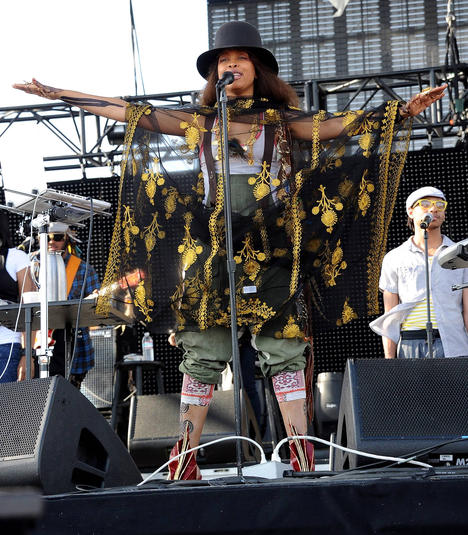 Erykah Badu - Erykah Badu burst on the scene with a three-foot tall head wrap, burning incense and wearing ornate Afrocentric jewels and no one seemed to bat a critical eye. Over the years, Badu's look continues to evolve and the Dallas native never fails to push the envelope in music and fashion.   (Photo: Kevin Winter/Getty Images)