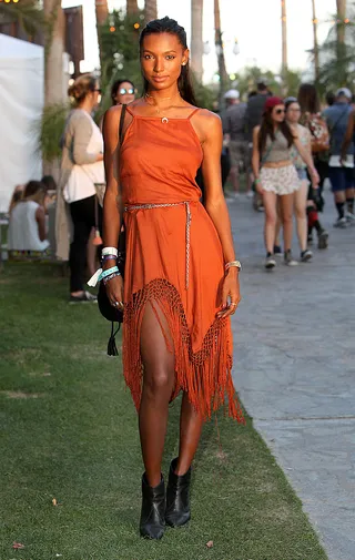 Jasmine Tookes - Orange you loving Jasmine’s look? The Victoria’s Secret model shines bright in a fringed Urban Outfitters frock and Rag and Bone booties.   (Photo: Rachel Murray/Getty Images for Coachella)