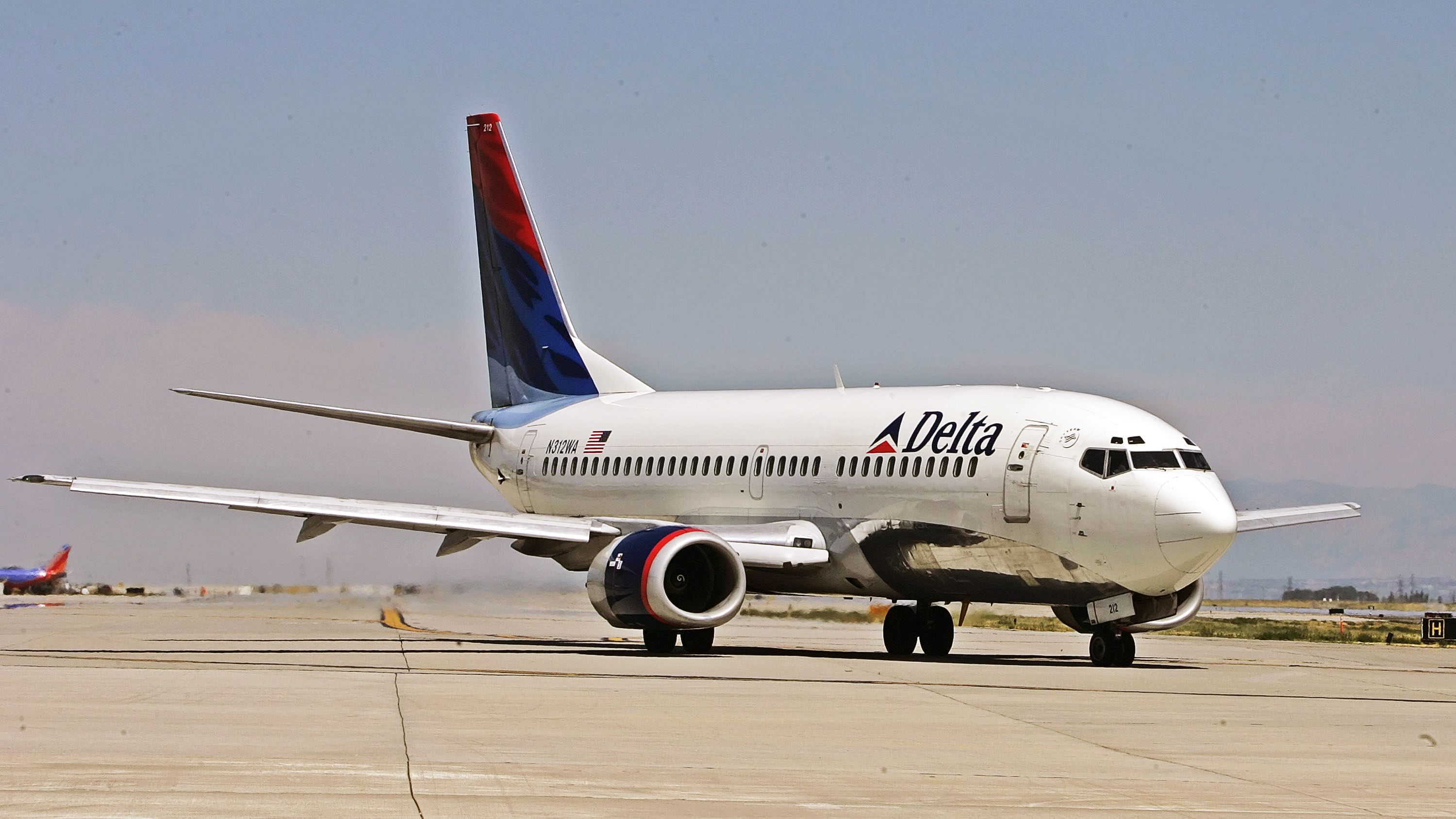 SALT LAKE CITY - AUGUST 12:  A Delta Airlines jet taxies for take-off at the Salt Lake International Airport August 12, 2005 in Salt Lake City, Utah. The resent increase in fuel prices has forced some airlines to raise ticket prices and may force some such as Delta into bankruptcy.  (Photo by George Frey/Getty Images)