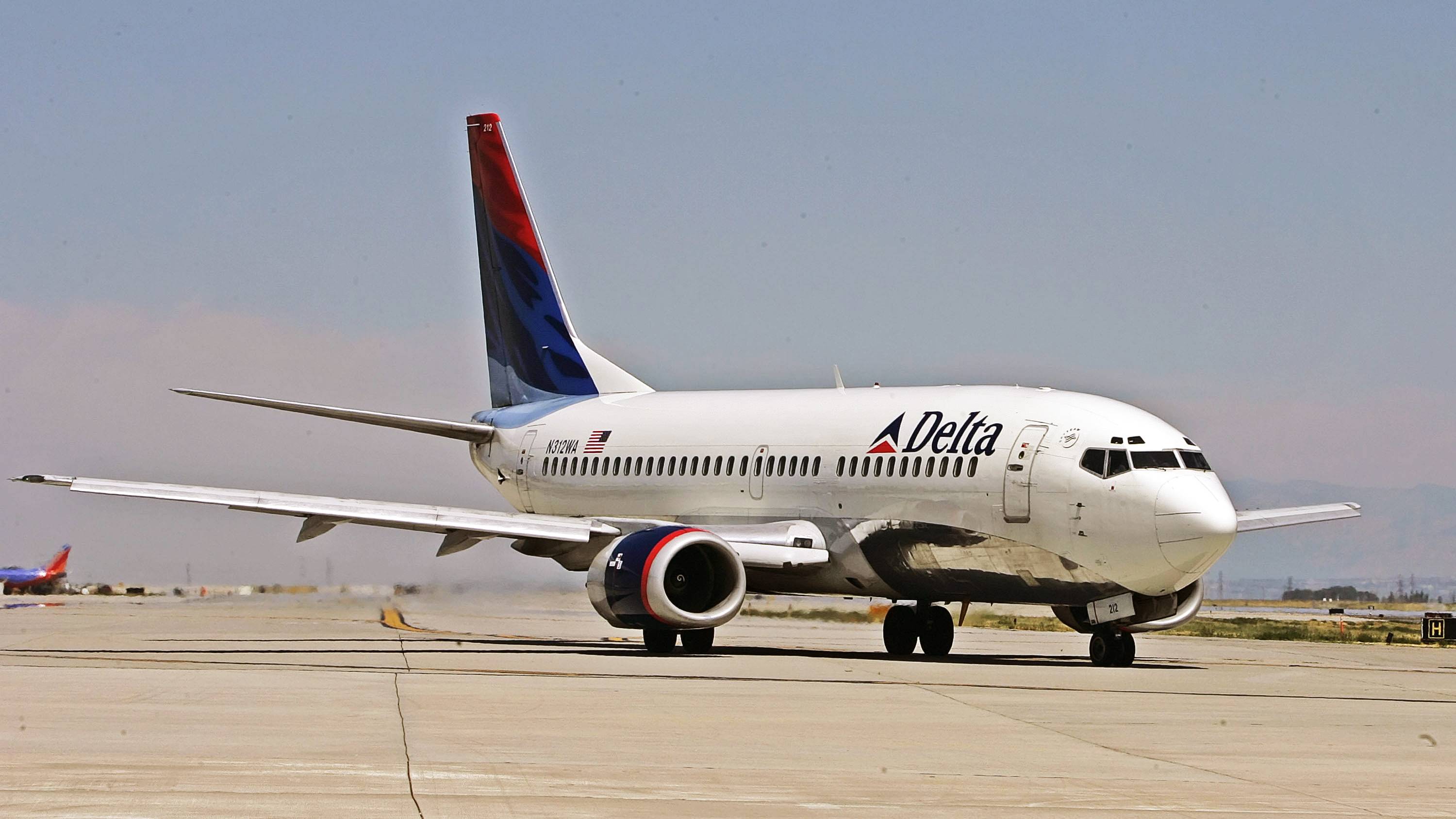 SALT LAKE CITY - AUGUST 12:  A Delta Airlines jet taxies for take-off at the Salt Lake International Airport August 12, 2005 in Salt Lake City, Utah. The resent increase in fuel prices has forced some airlines to raise ticket prices and may force some such as Delta into bankruptcy.  (Photo by George Frey/Getty Images)