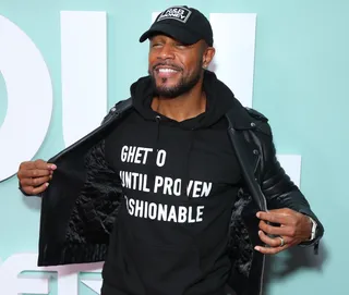 Singer Tank makes a fashion statement at the premiere in Los Angeles. - (Photo by Leon Bennett/Getty Images for BET)