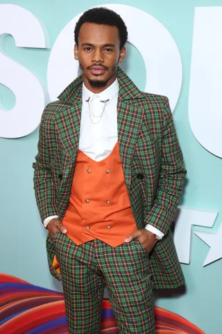 Jelani Winston stops for the pictures on the red carpet. - (Photo by Leon Bennett/Getty Images for BET)