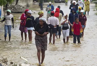 Isaac Pushes Haitian Migrant Boat Toward Bahamas - Bahamas immigration officials report that a boat carrying 152 migrants from Haiti ran aground in the country amid the rough seas caused by Tropical Storm Isaac. Survivors say that a total of 170 people were on the boat when it left Haiti.&nbsp;(Photo: AP Photo/MINUSTAH, Logan Abassi)